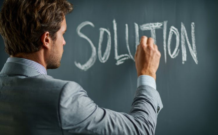 Businessman Planning Innovative Solutions on a Transparent Board in an Office Setting During Daytime
